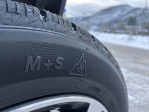 Close-up of M+S and mountain snowflake symbols on winter tire sidewall in Kamloops BC