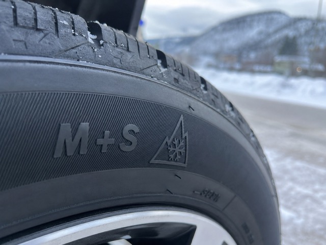 Close-up of M+S and mountain snowflake symbols on winter tire sidewall in Kamloops BC
