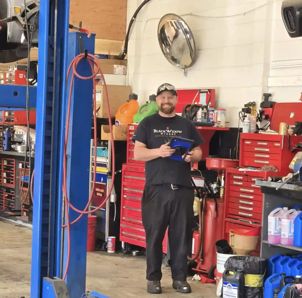 BC vehicle inspection checklist being reviewed by technician in Kamloops shop