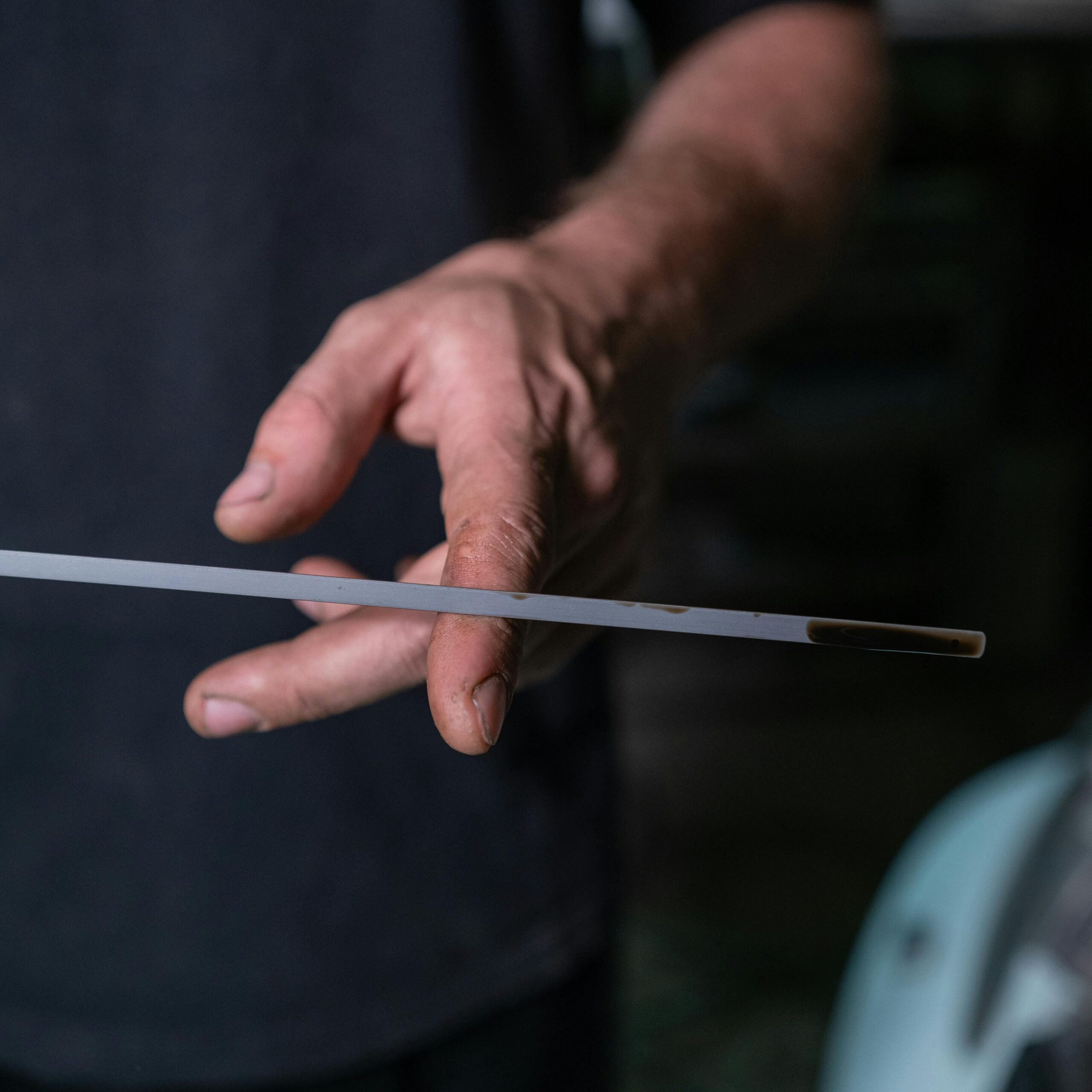 close-up of oil dipstick showing low oil level during vehicle inspection Kamloops BC
